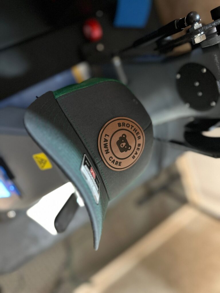 Custom leather patches pressed onto baseball hat