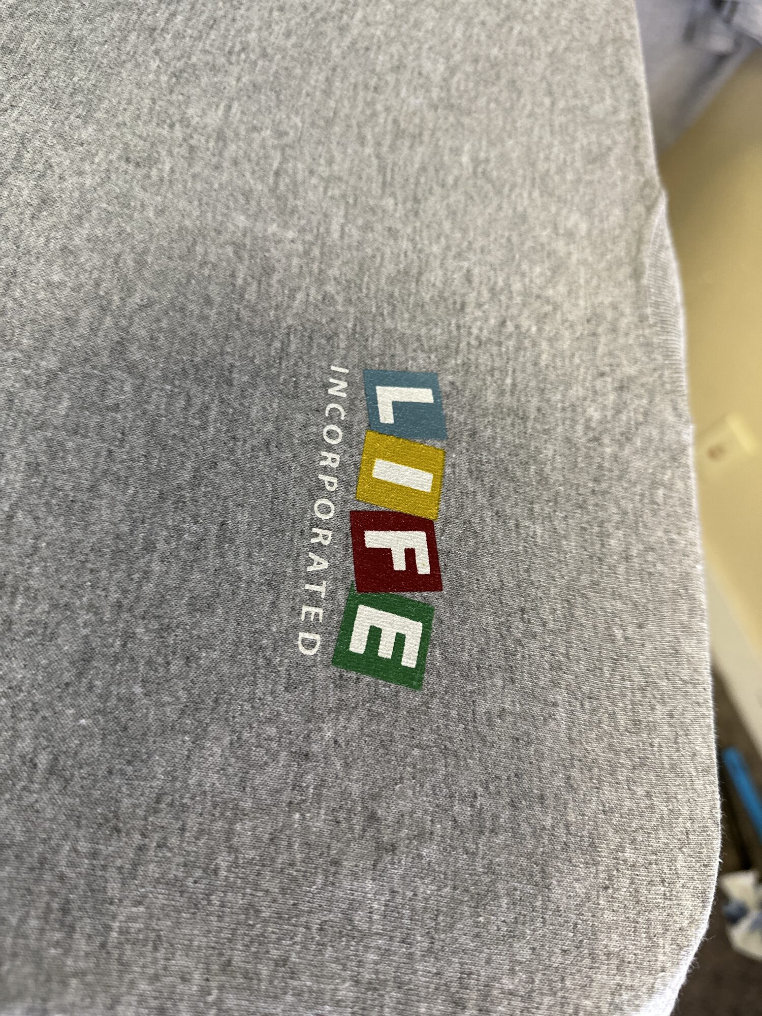 Custom screen printed logo printed on left chest of a t-shirt