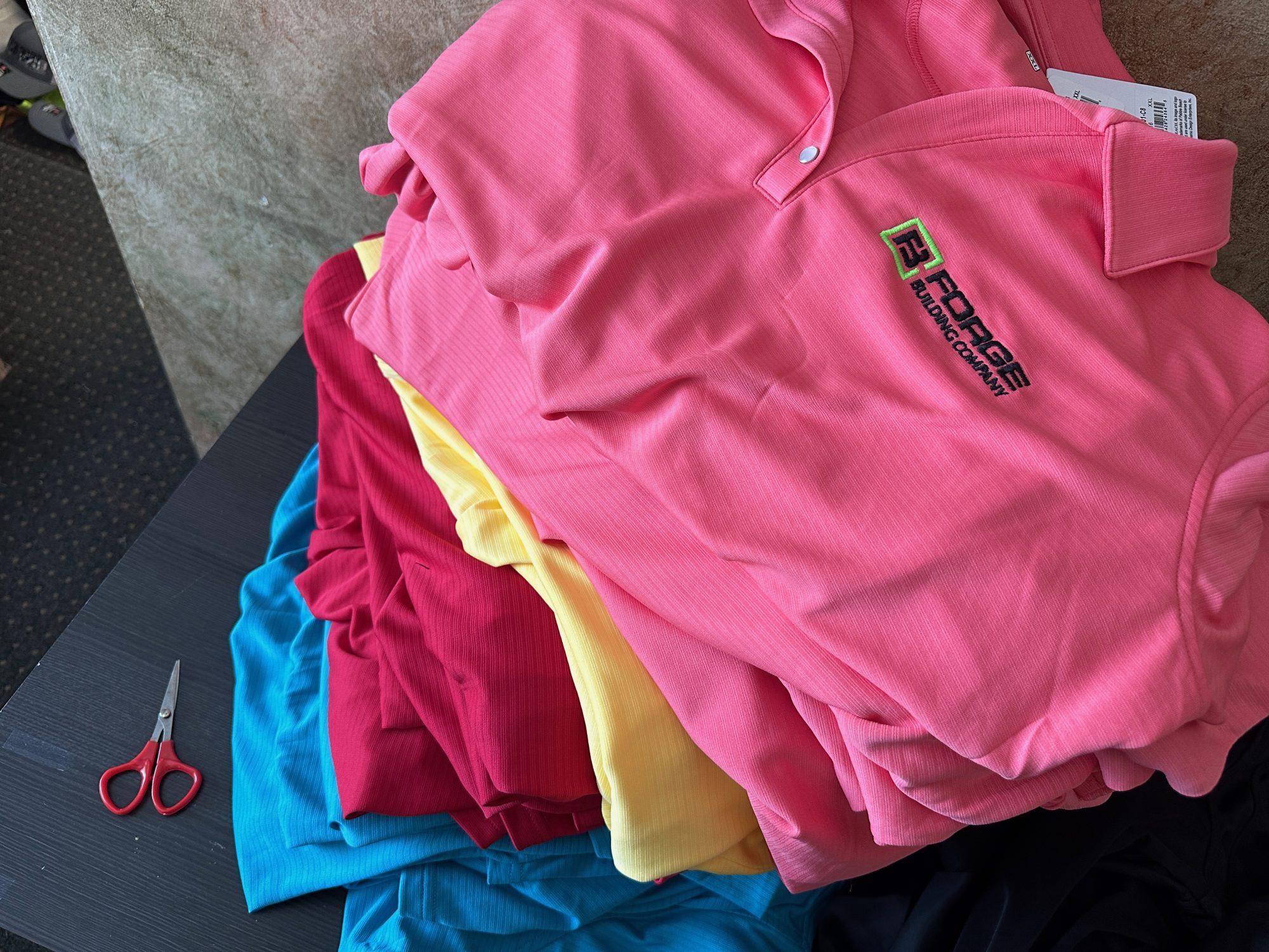 Custom business polos in bulk with logo embroidered on left chest