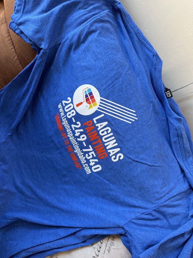 Company logo screen printed onto back of custom shirts in bulk