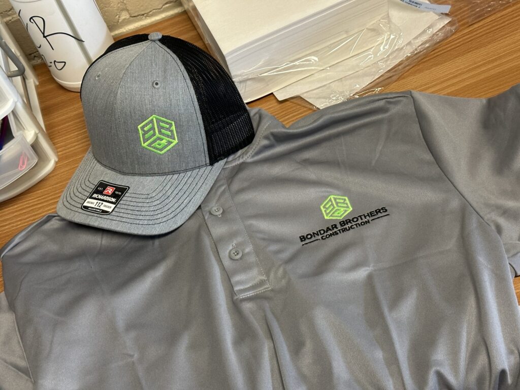 Custom embroidered polo and custom embroidered hat for local company