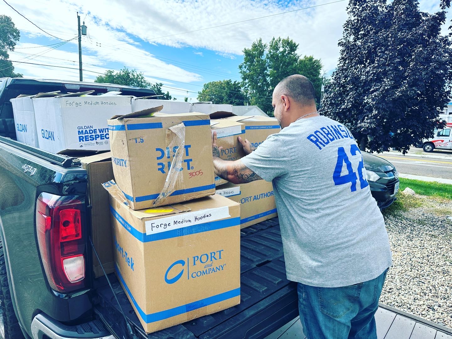 Loading a bulk custom t-shirt order for free delivery in Nampa