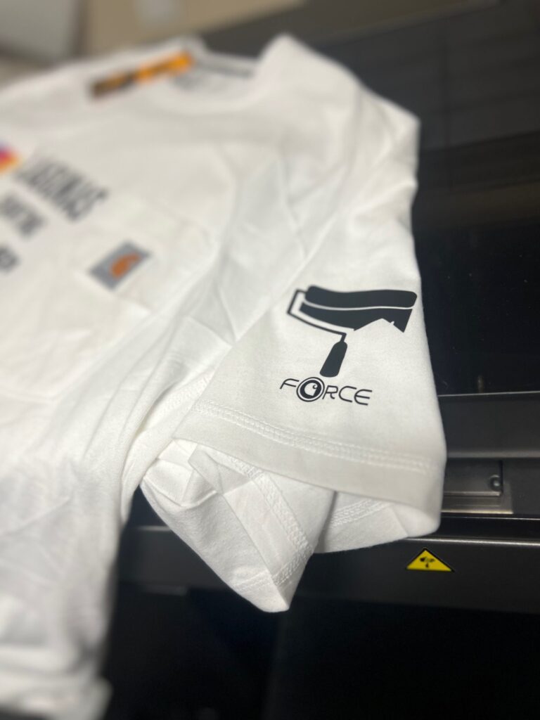 Custom t-shirts with sleeve placement from The Print Plug screen printing shop in Nampa