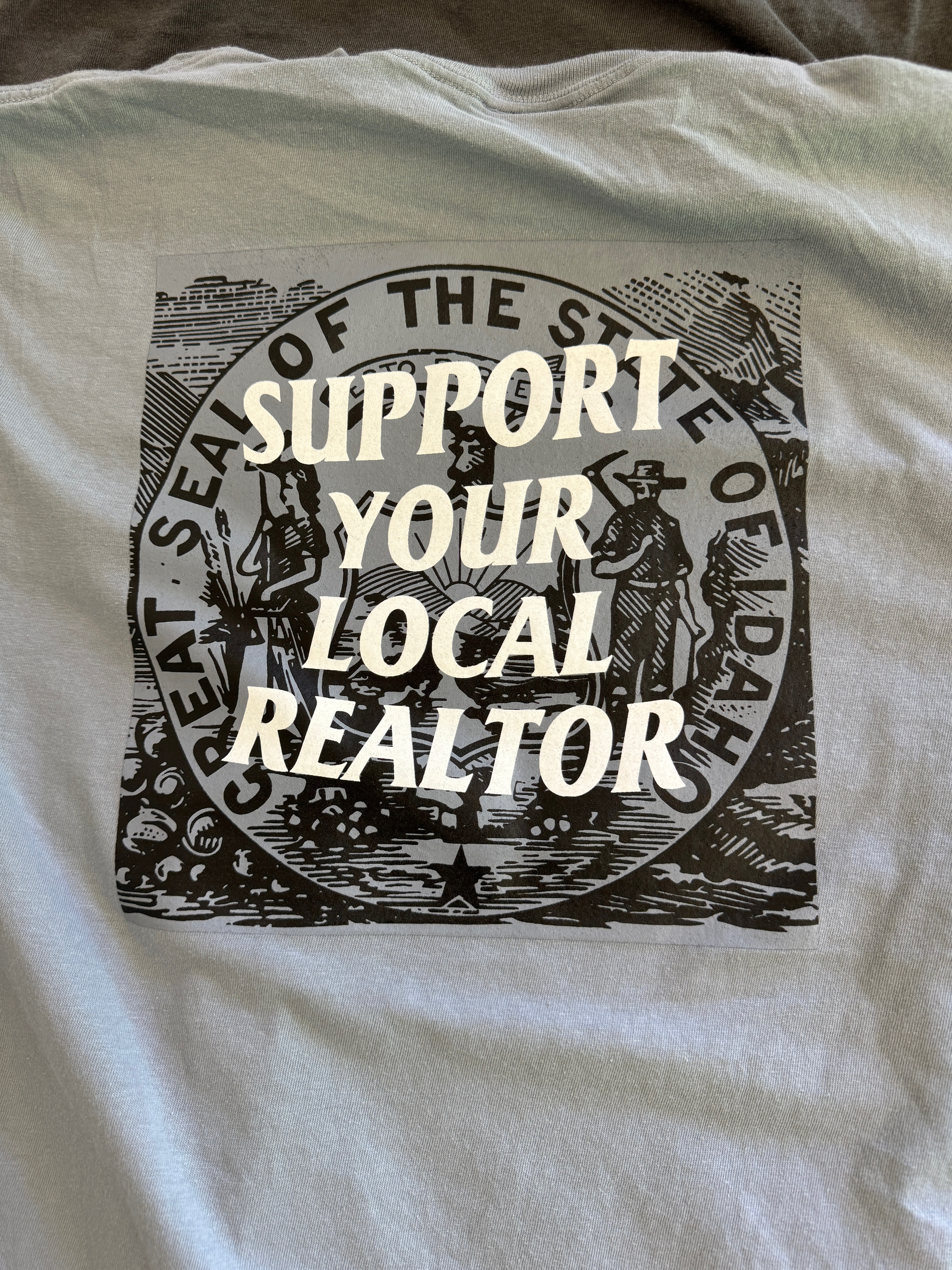 Custom t-shirt with screen printed graphic for local realtor company in Nampa, Idaho