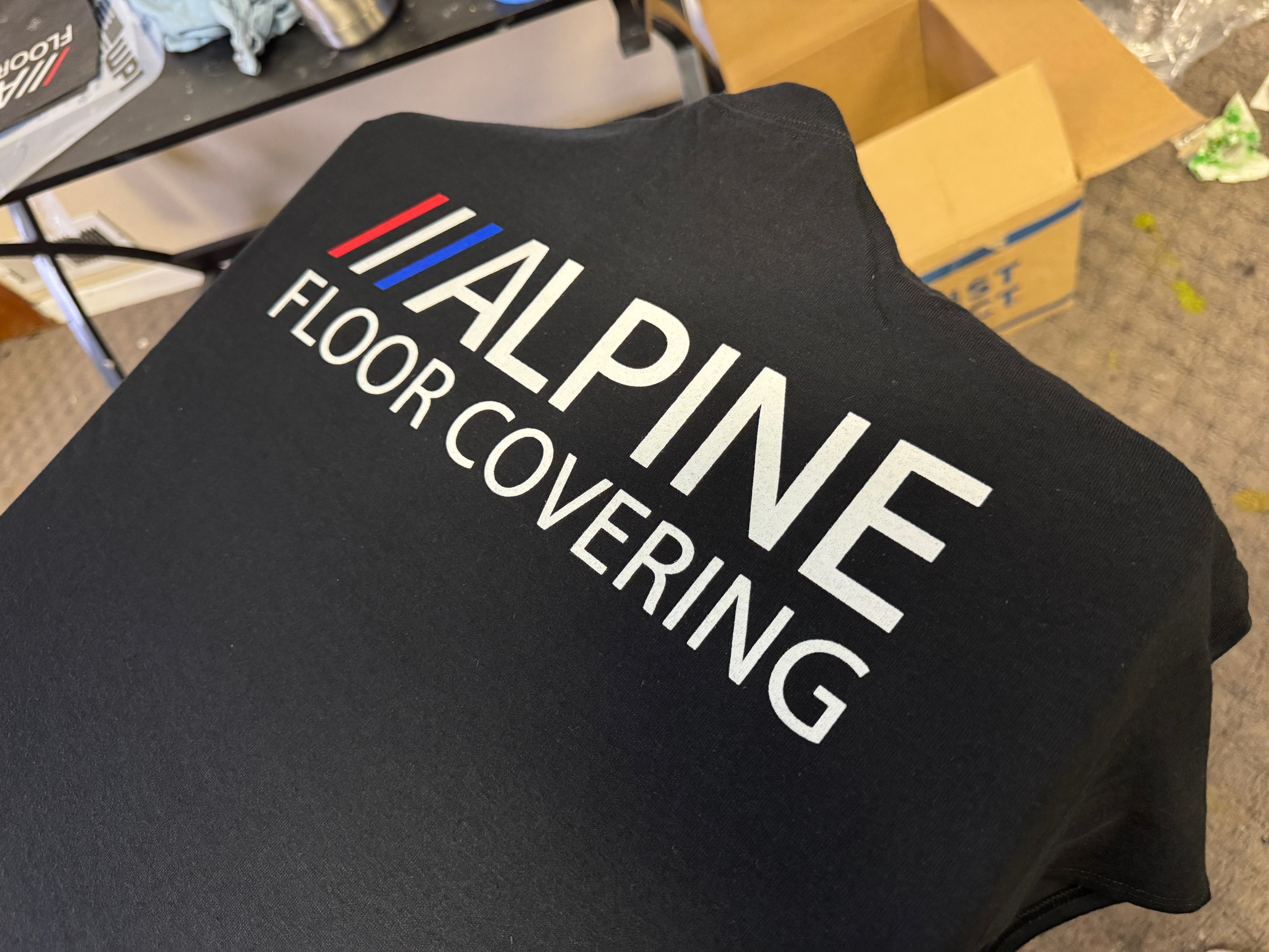 Custom white-on-black screen printed shirts at The Print Plug custom t-shirt shop in Nampa, Idaho