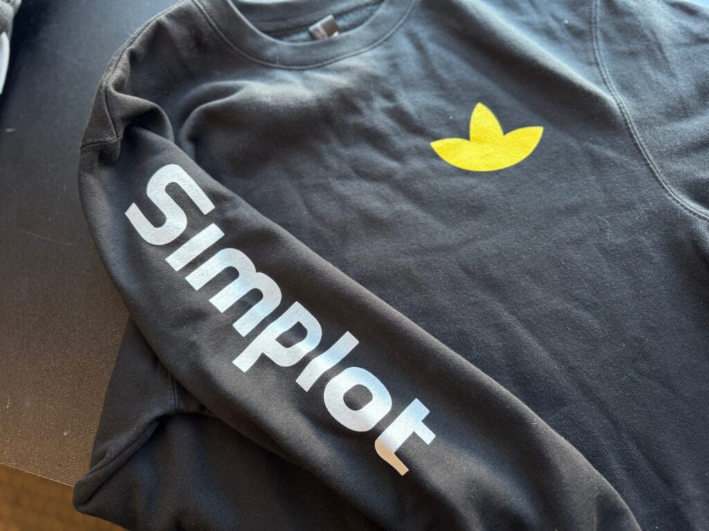 Custom screen printed shirts with left chest and sleeve placement for a large company in Nampa