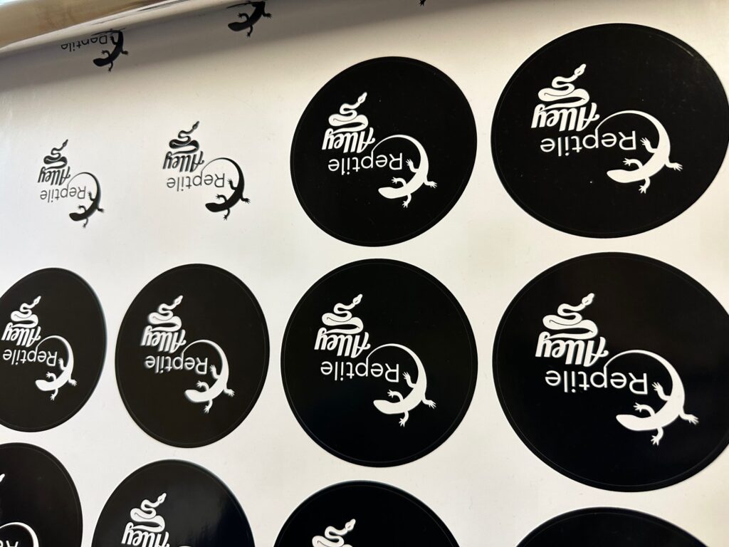 Custom stickers being printed in bulk for a local business owner near Nampa