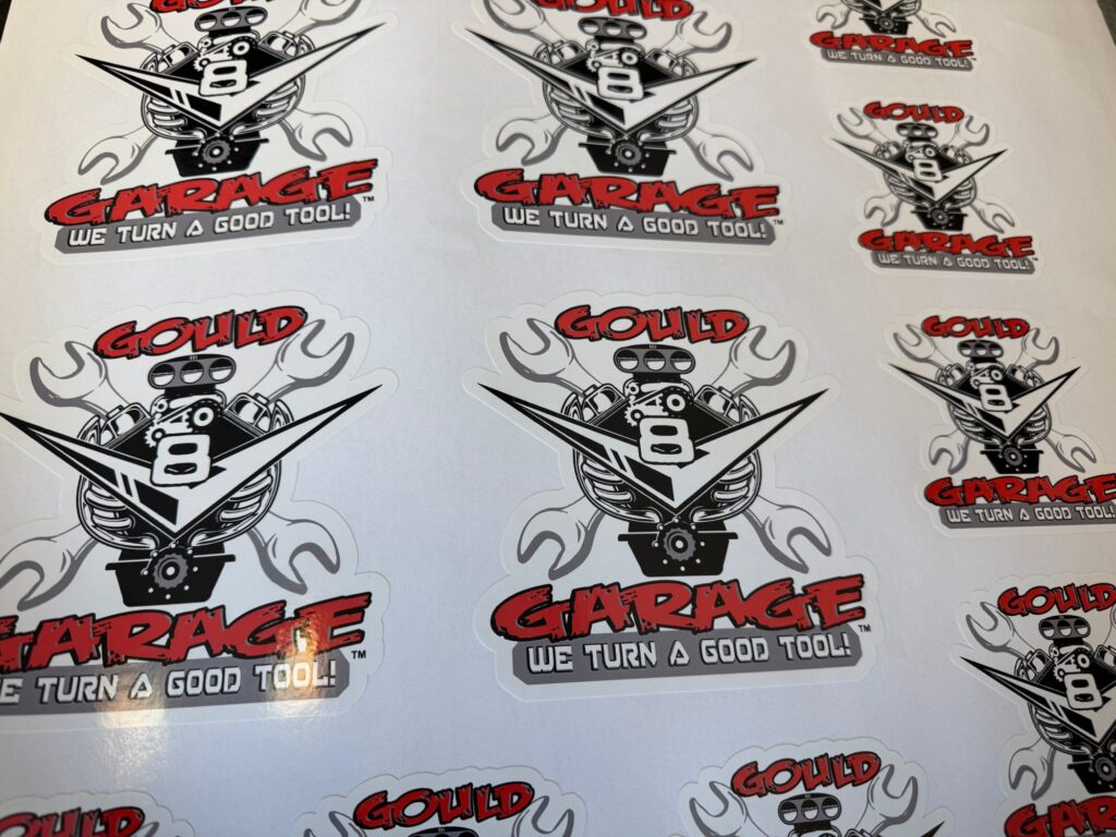Gang sheet of custom die-cut vinyl stickers being printed in Nampa