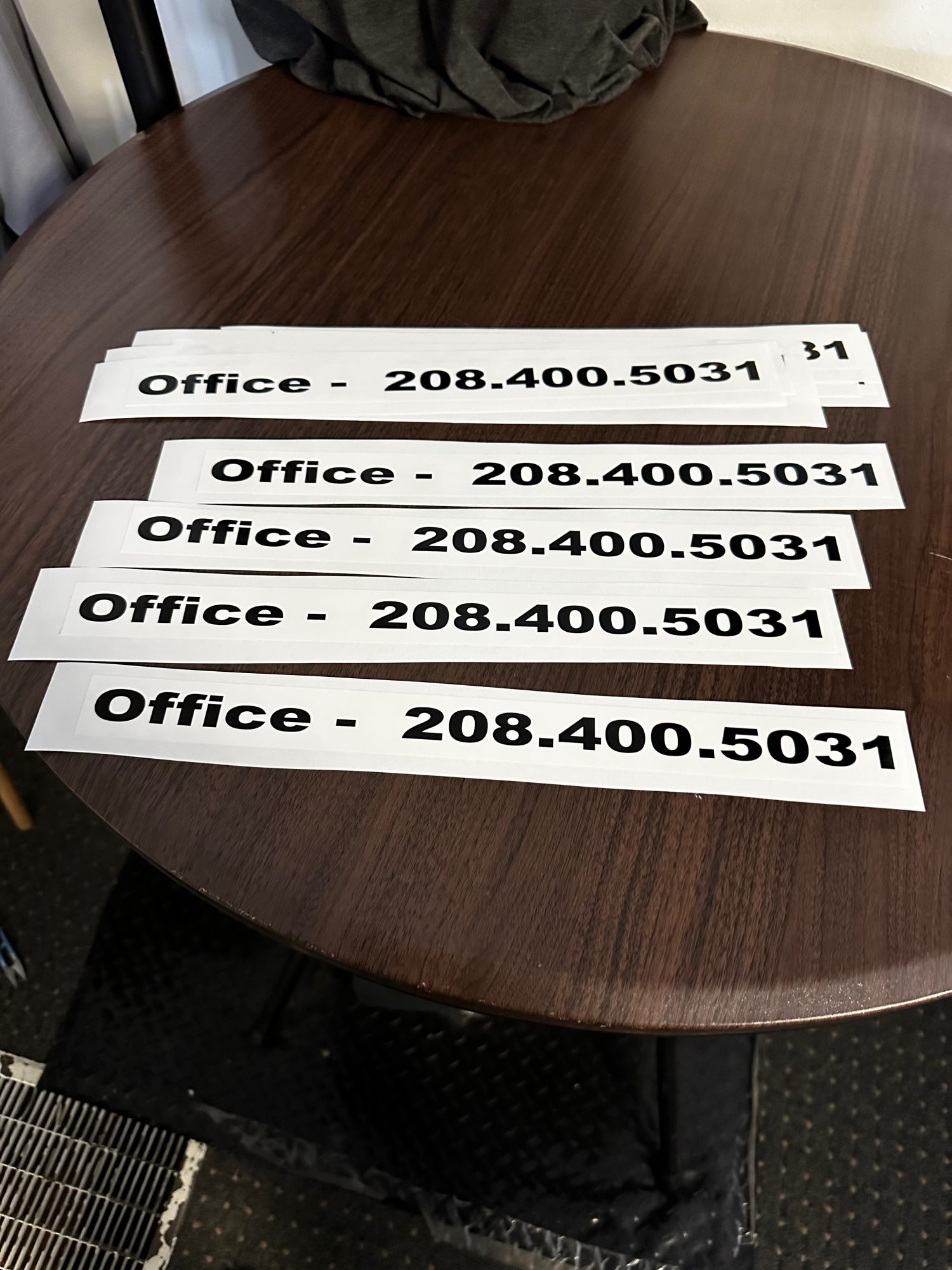 Custom stickers with phone number and business information at The Print Plug