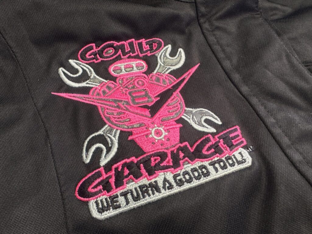 Logo embroidered on custom jacket for local garage company from The Print Plug embroidery shop in Nampa