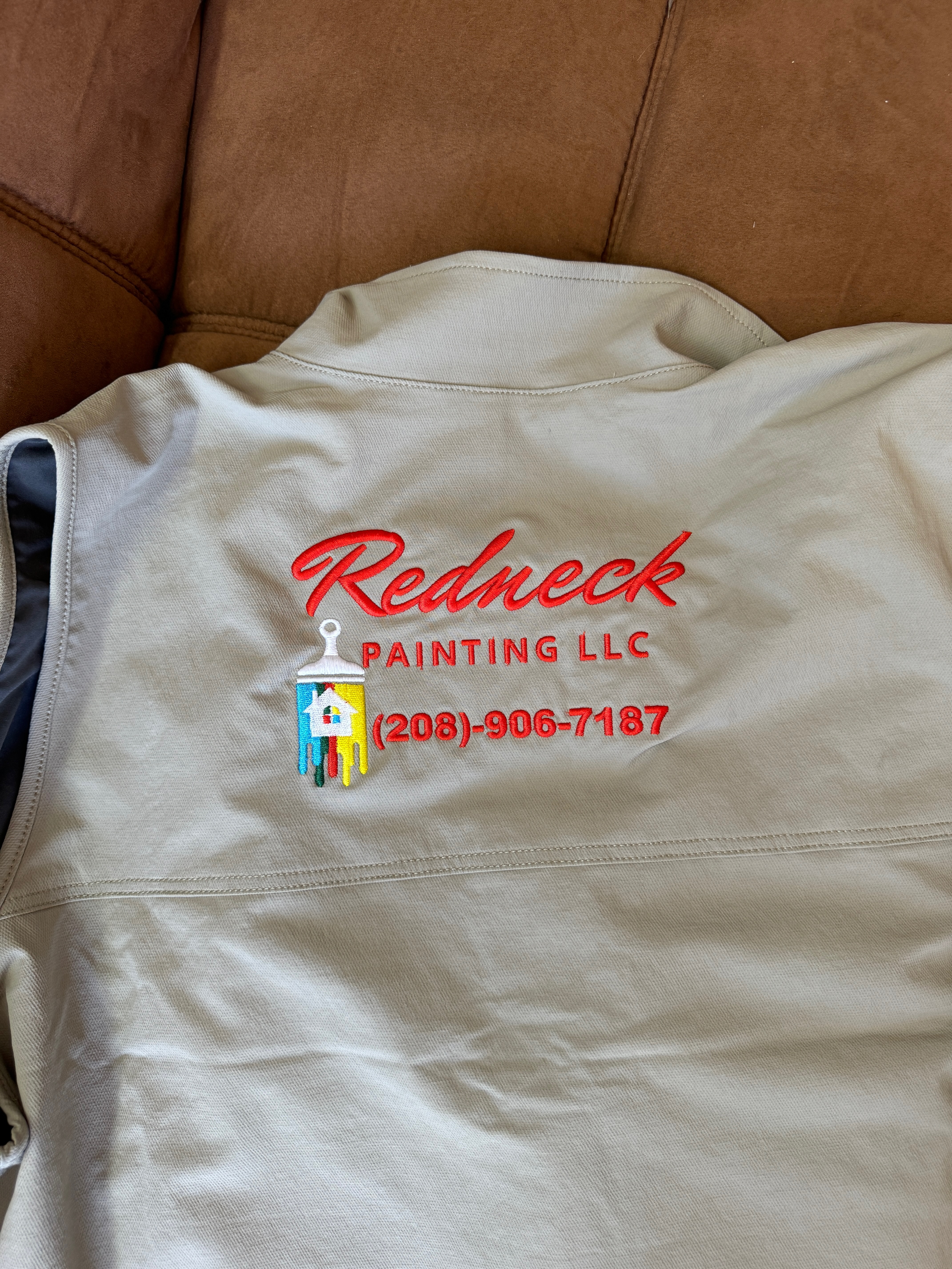 Large back of a custom embroidered vest for a painting company in Nampa, Idaho