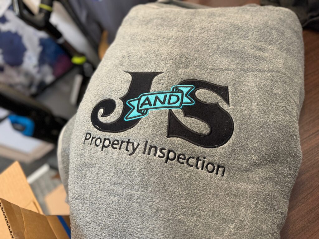 Custom embroidered logo on back placement of a fleece sweatshirt