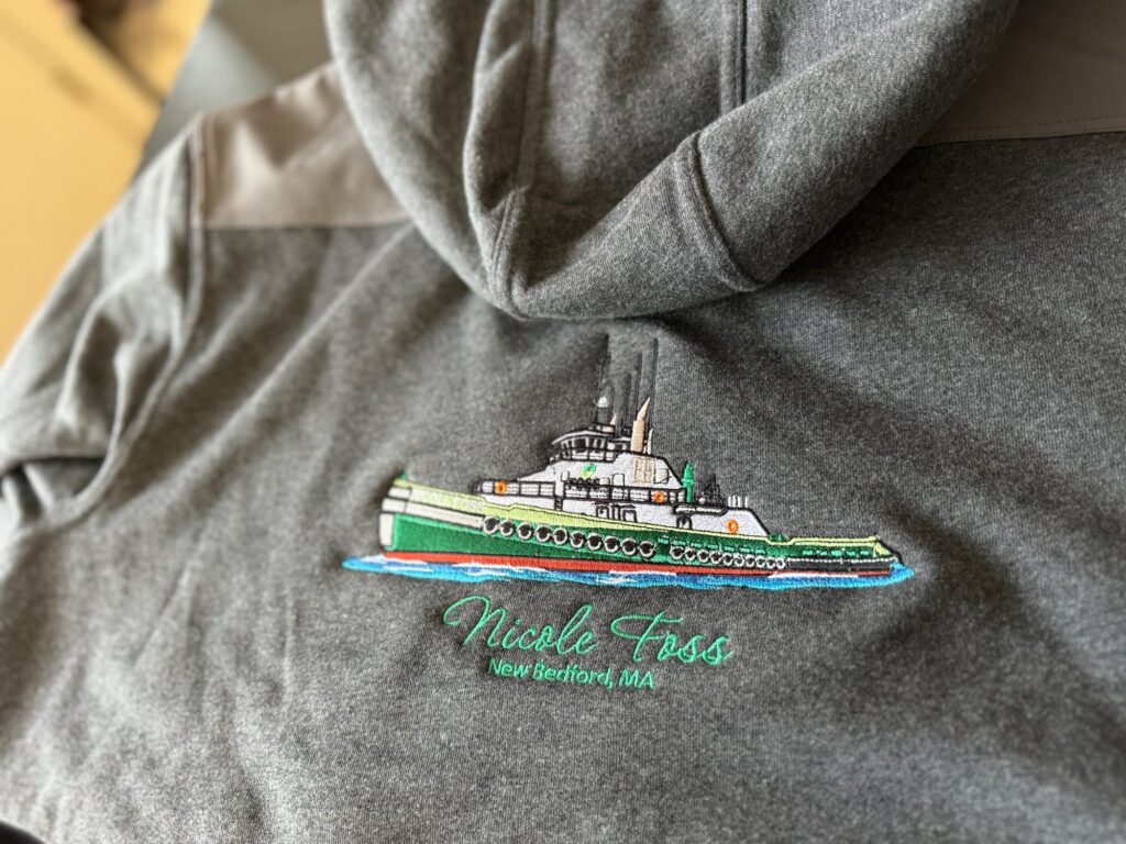 Custom embroidered logo on a hoodie for a local company in Nampa