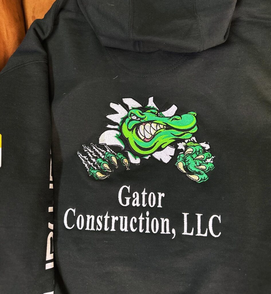 Custom embroidered hoodie with large back placement for a local construction company in Nampa, Idaho