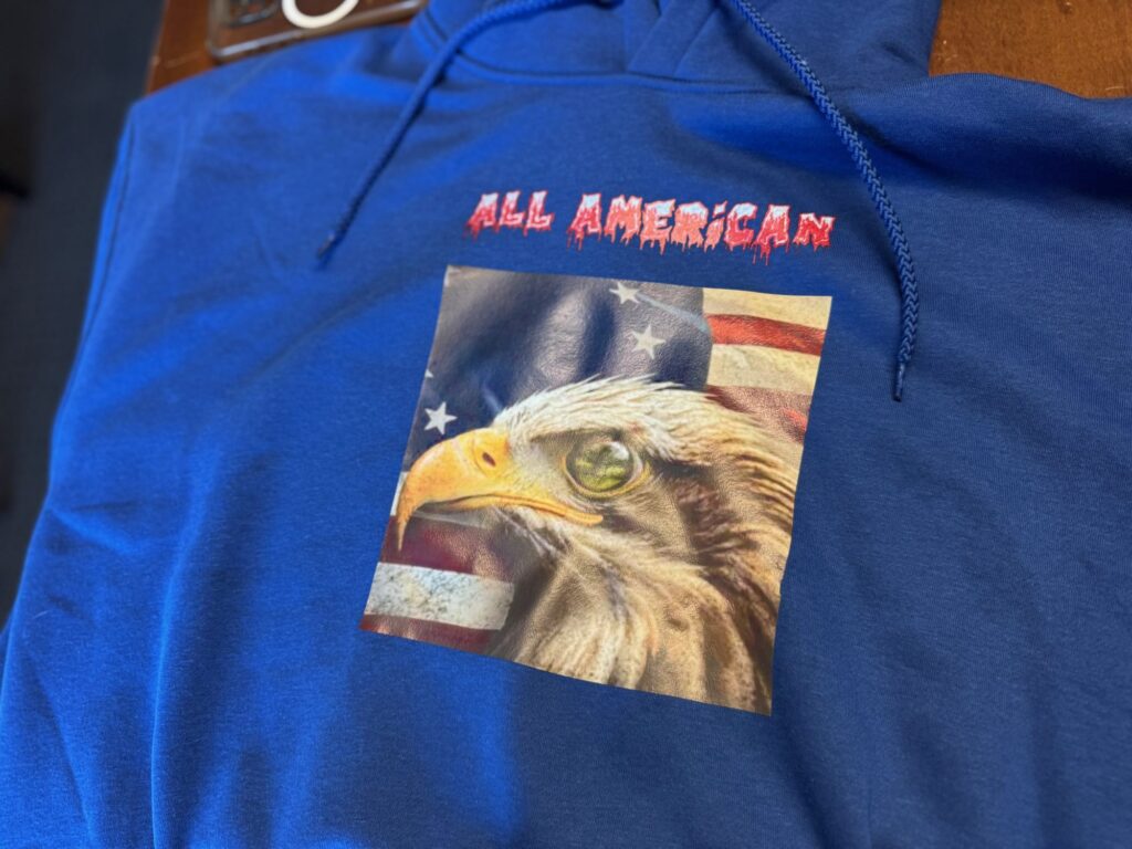 Custom HTV print with screen printing on a t-shirt for local lawn care company in Nampa