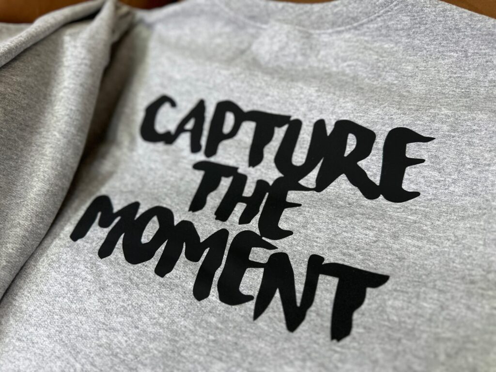 Close up of a custom HTV print on a t-shirt at The Print Plug in Nampa