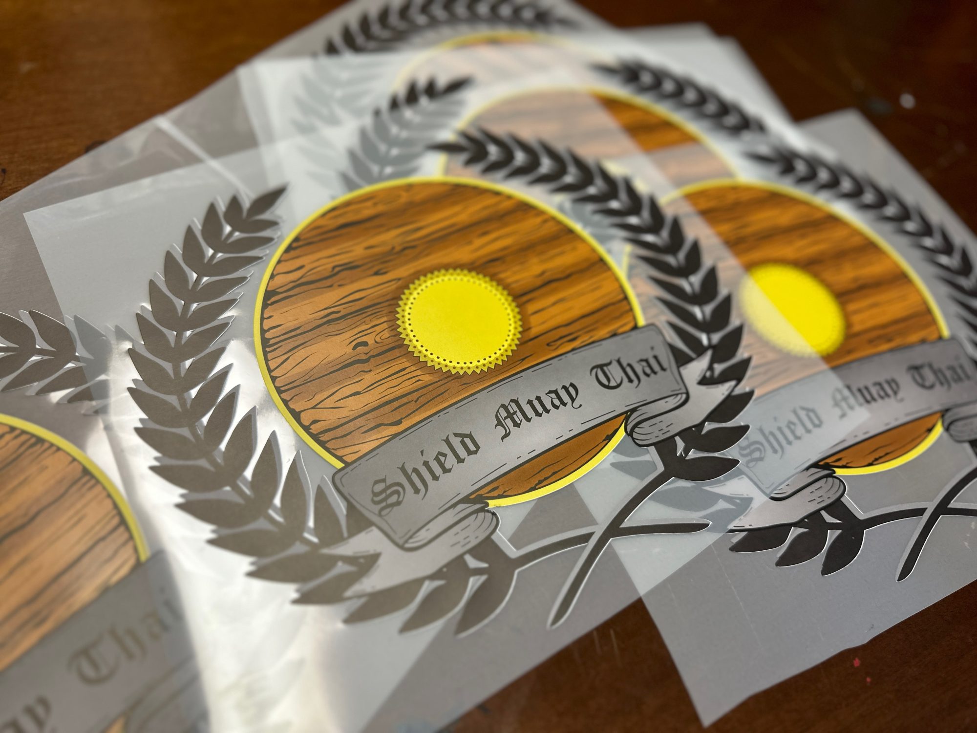 Custom HTV prints ready to be applied to vinyl shirts