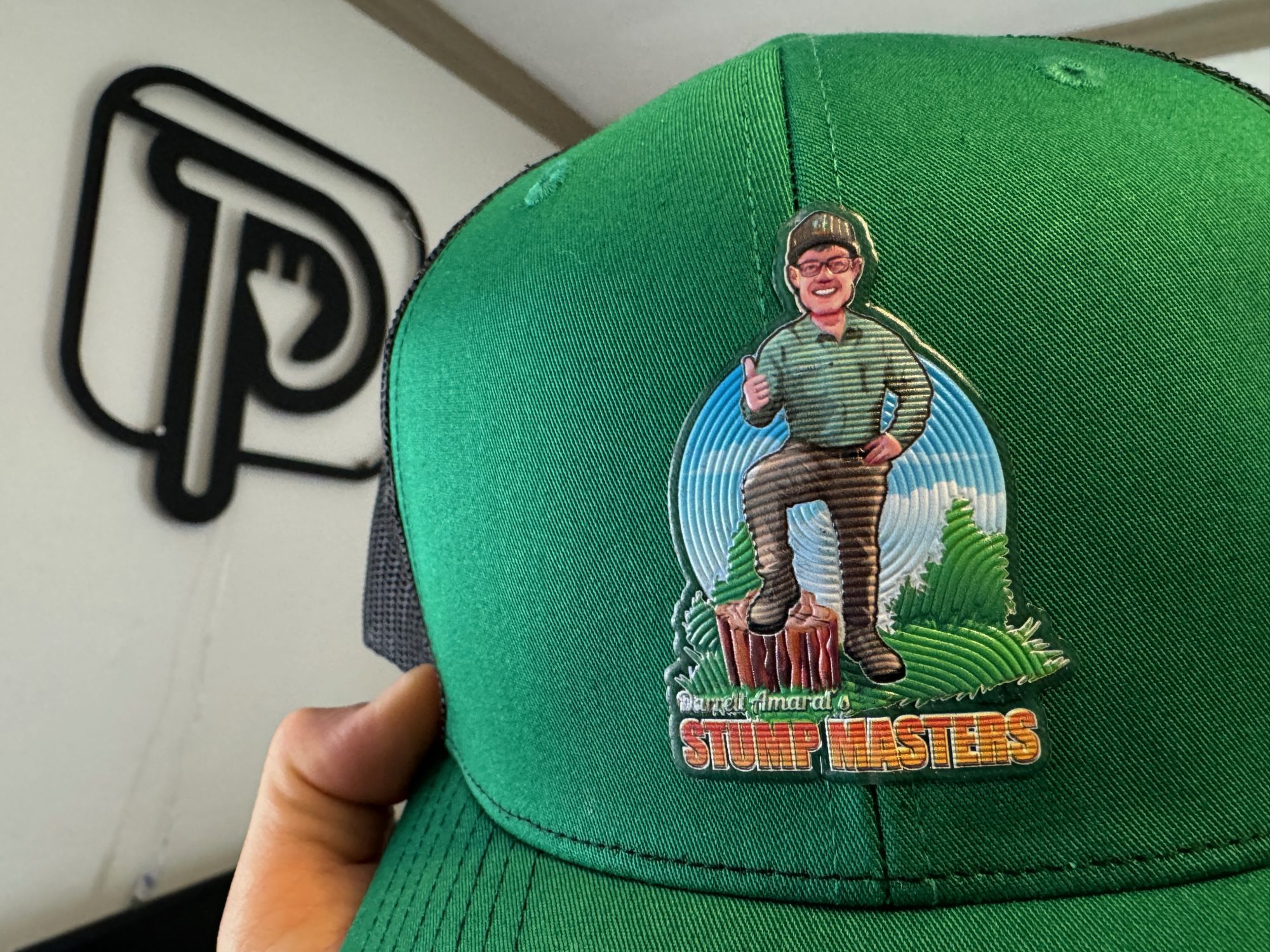 Custom vinyl patch on a baseball hat for a tree stump removal company in Nampa