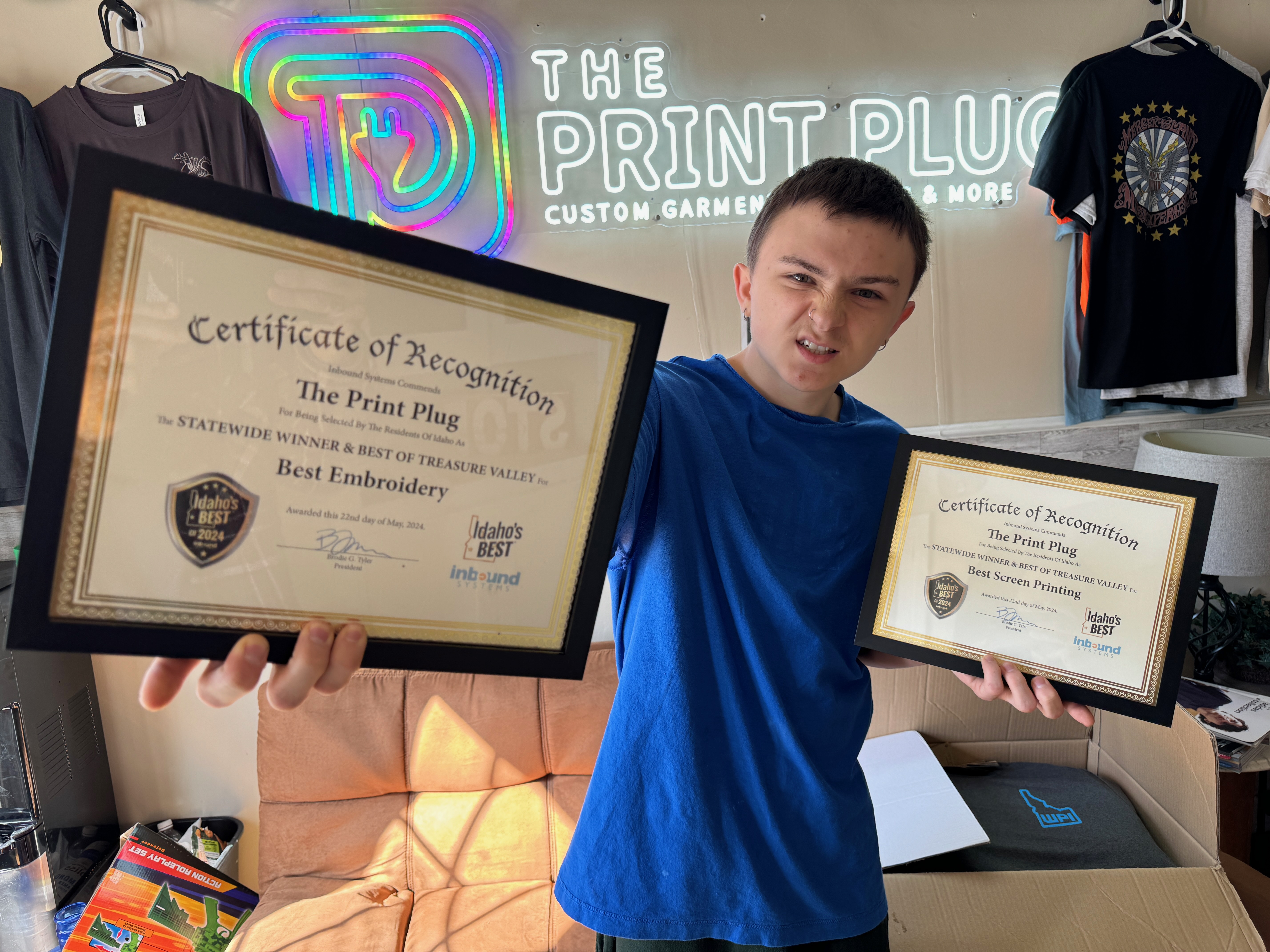 Showing off our Idaho's Best Screen Printing and Embroidery Shop awards in Nampa