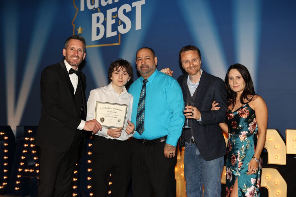 Accepting an award for Best Embroidery and Screen Printing in Idaho