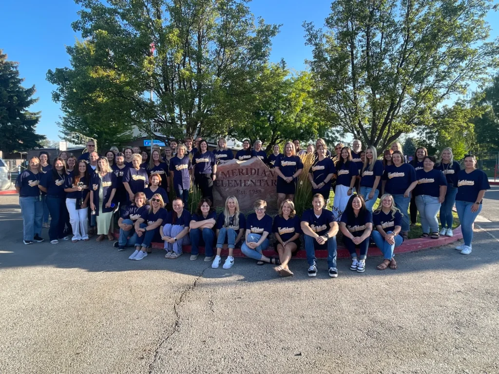 Group of students and faculty with custom printed t-shirts
