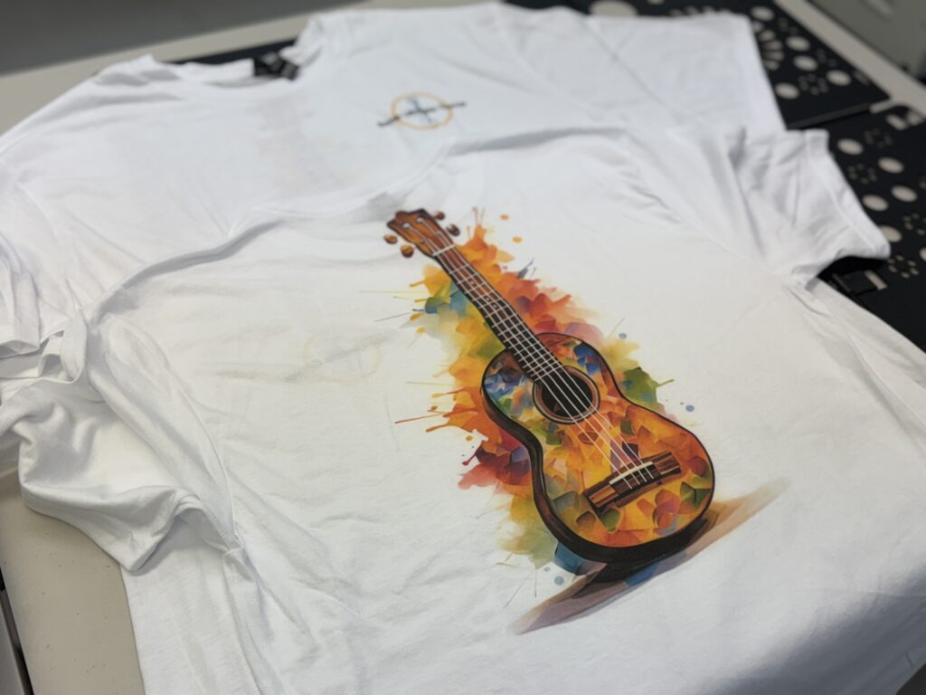 Colorful DTF print of a guitar on a t-shirt