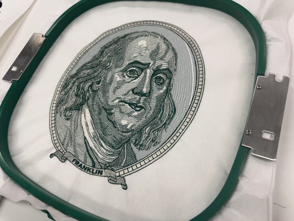 Custom embroidered hundred dollar bill graphic