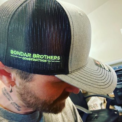 Custom hats at The Print Plug embroidery shop in Nampa