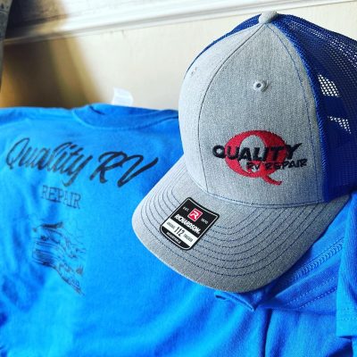 Hats and t-shirts at The Print Plug embroidery and screen printing shop in Nampa