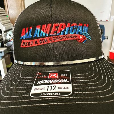 Logos embroidered onto a hat at The Print Plug in Nampa