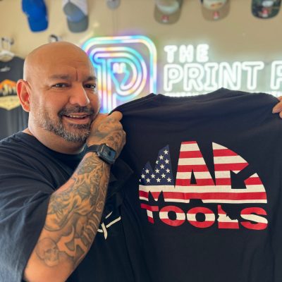 Showing off a custom screen printed t-shirt for a large tool company in Nampa