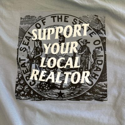 Custom t-shirt with screen printed graphic for local realtor company in Nampa, Idaho