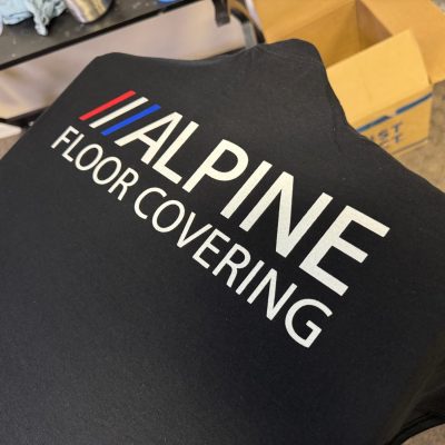 Custom white-on-black screen printed shirts at The Print Plug custom t-shirt shop in Nampa, Idaho