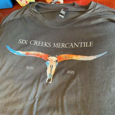 Customized graphic tee with watercolors by The Print Plug in Nampa