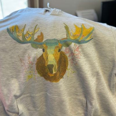 Custom graphic tee with DTG printing of a watercolor nature image