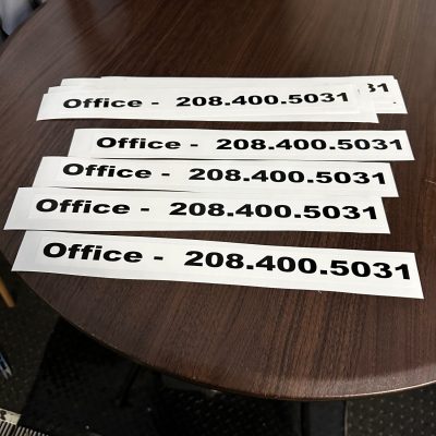Custom stickers with phone number and business information at The Print Plug