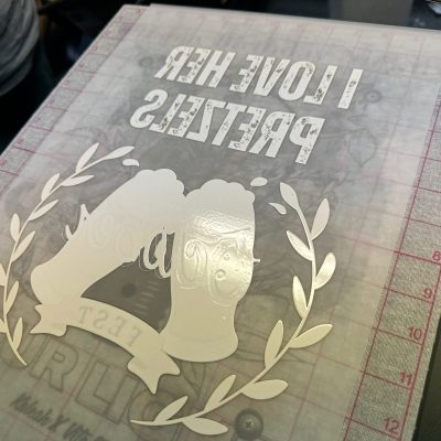 Custom DTF transfer about to be applied onto a t-shirt at The Print Plug in Nampa