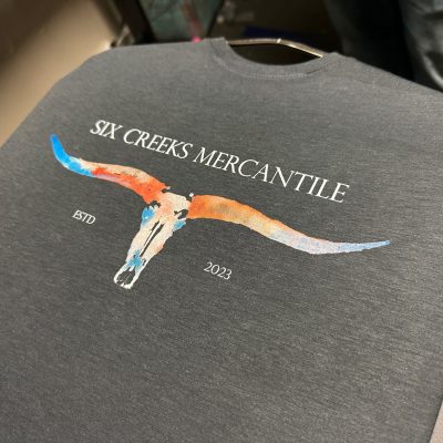 Custom graphic tee with watercolors made by DTG printing at The Print Plug in Nampa