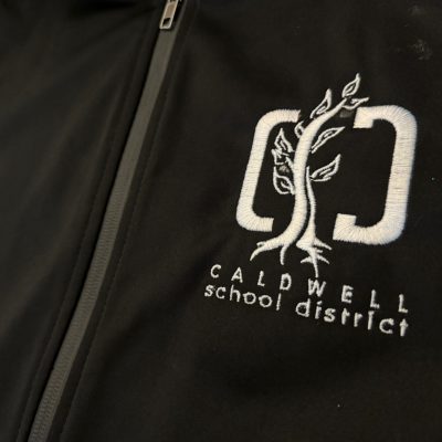Logo embroidered onto a custom jacket at The Print Plug in Nampa
