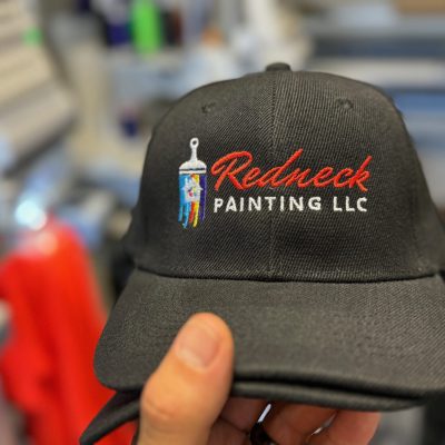 Logo on a custom embroidered hat for a painting company at The Print Plug in Nampa