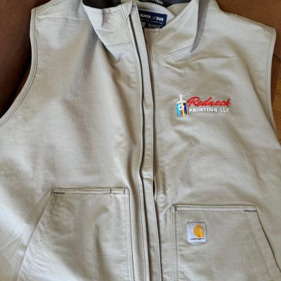 Front chest placement of a logo on a custom vest from The Print Plug embroidery shop in Nampa