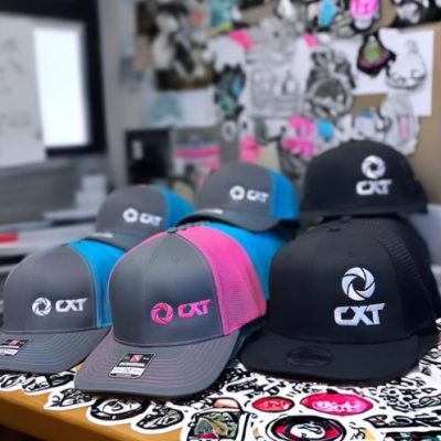 Embroidered hats for a large construction company, made at The Print Plug embroidery shop in Nampa