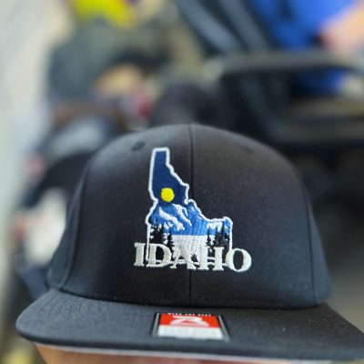 Custom embroidered hat with intricate Idaho logo made for a local brand near Nampa