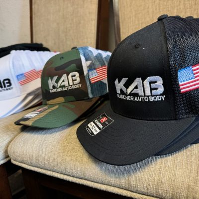 Custom embroidered hats with front and side placement for a business near Nampa