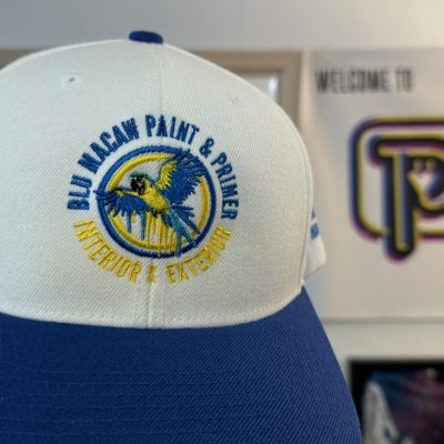 Custom embroidered hat with final detail for a local painting company near Nampa