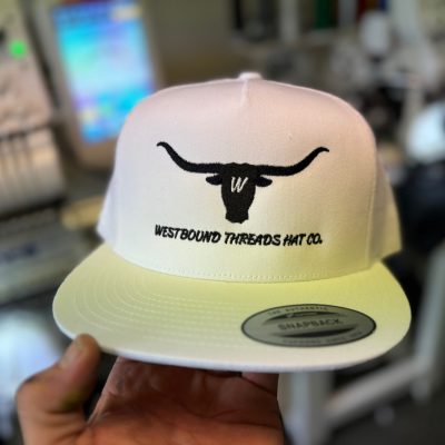 Custom embroidered hat with company logo at The Print Plug embroidery shop in Nampa