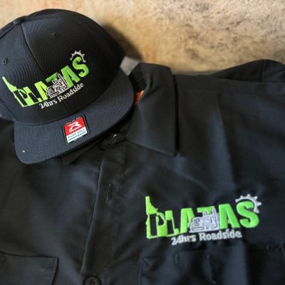 Custom embroidered hats and a custom embroidered shirt from The Print Plug in Nampa
