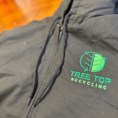 Custom embroidered hoodie with logo on left chest for local recycling company near Nampa