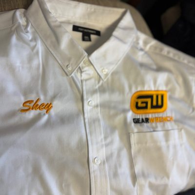 Custom embroidered shirt button-up with logo embroidered over pocket and opposite