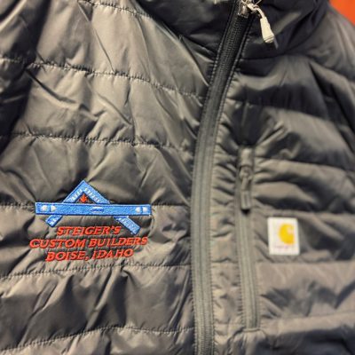 Custom embroidered vest with fine detail in logo from The Print Plug embroidery shop in Nampa